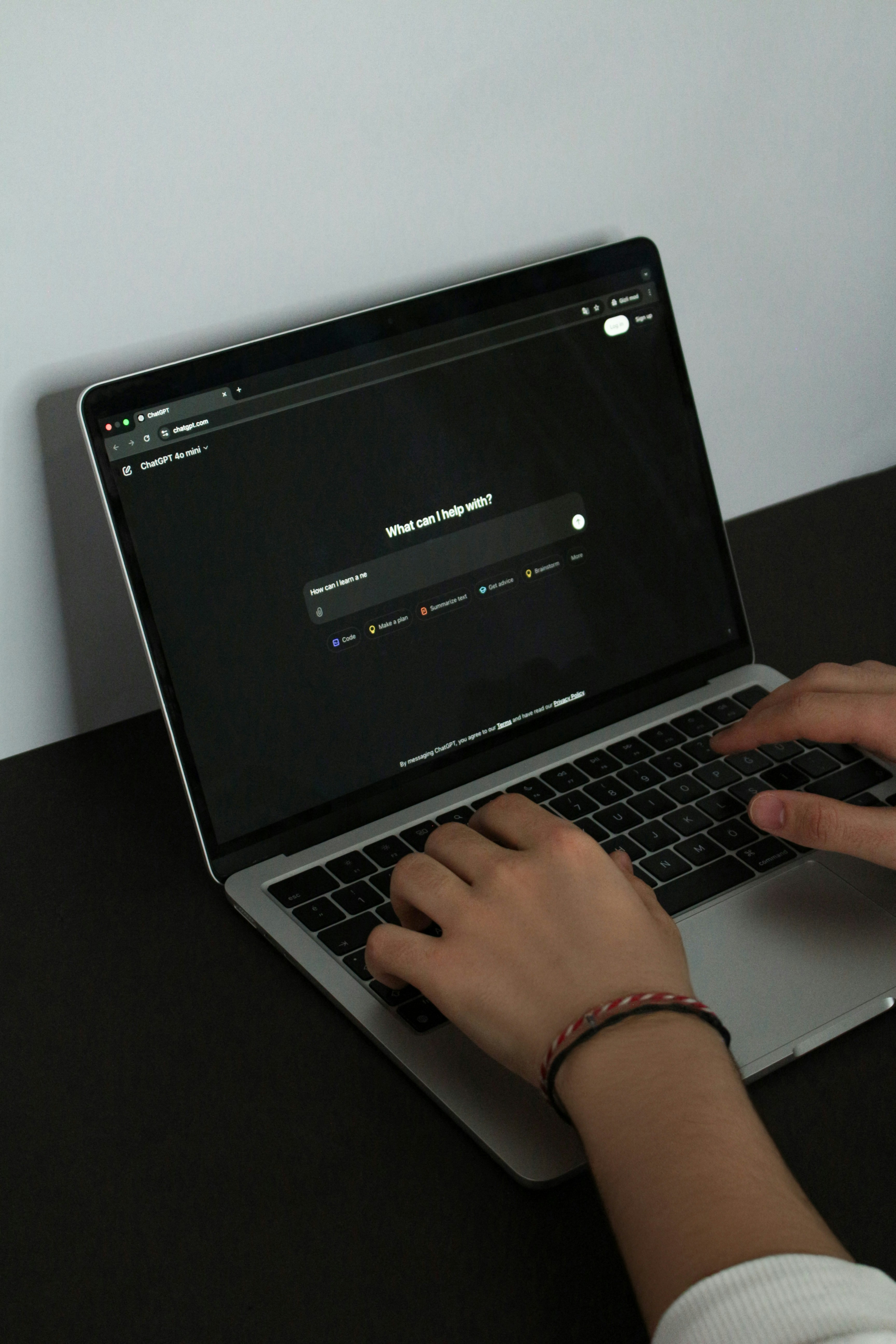A person using an AI tool on a laptop